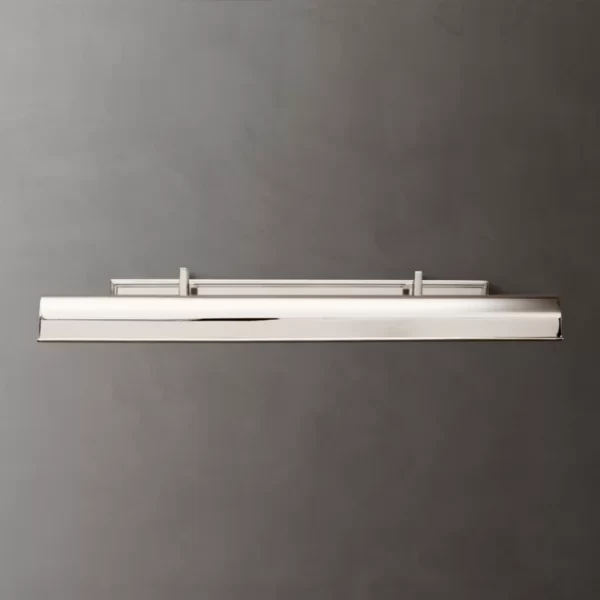 Modern white lighting fixture mounted on a gray wall.