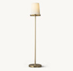 Elegant floor lamp with a white lampshade and sleek gold stand.