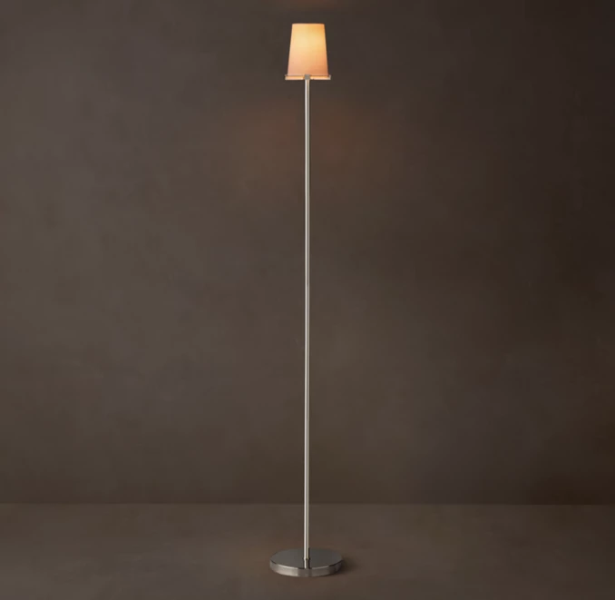 Modern Gorvey lighting floor lamp with a sleek design and warm light.