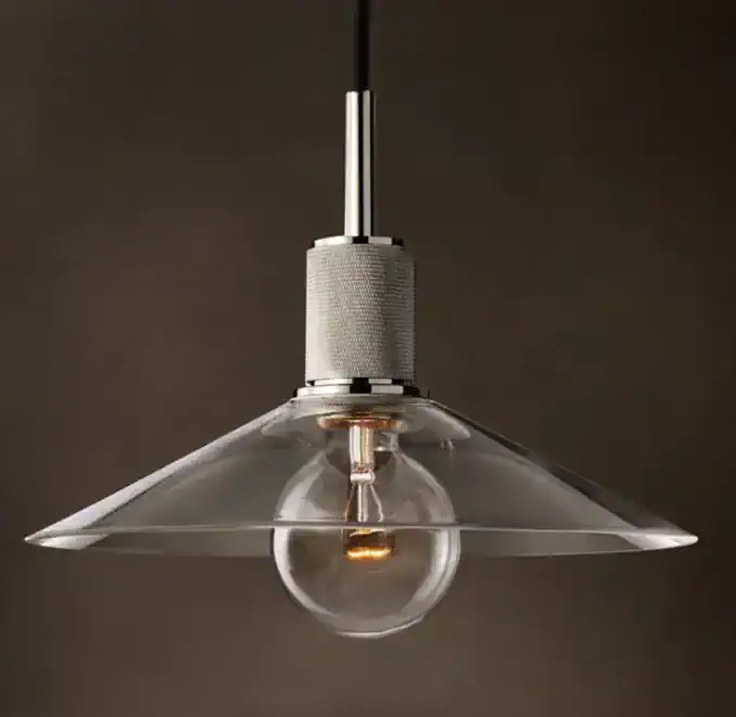 Modern pendant lamp with glass shade and exposed bulb for stylish lighting.