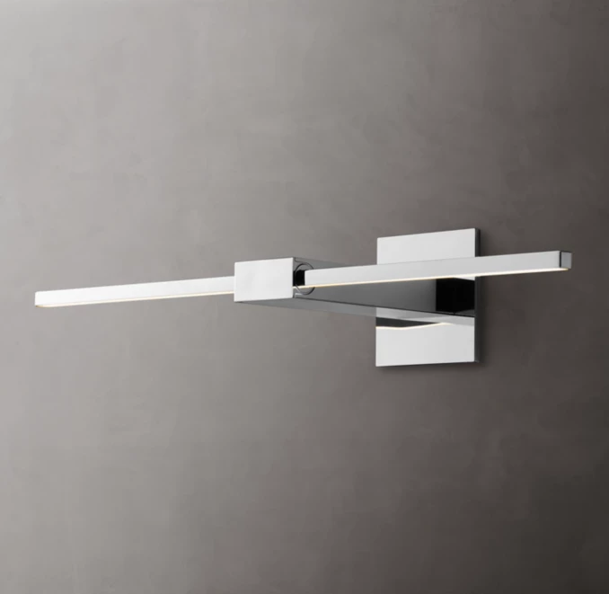 Sleek modern LED wall light fixture on gray wall.