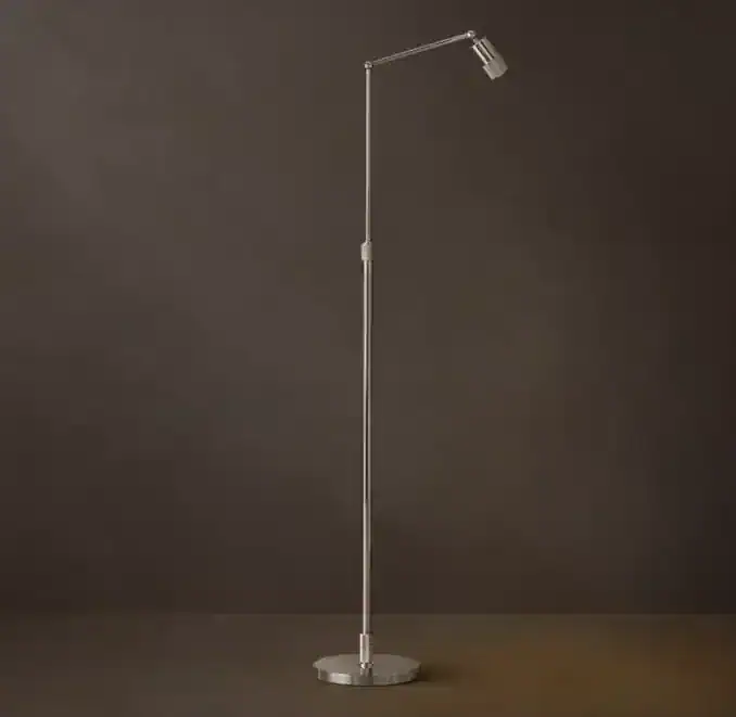Sleek modern floor lamp with adjustable head and slim design for contemporary spaces.