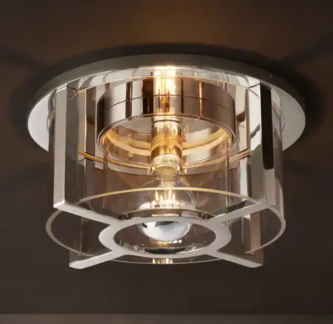Elegant modern ceiling light fixture with glass and gold accents.