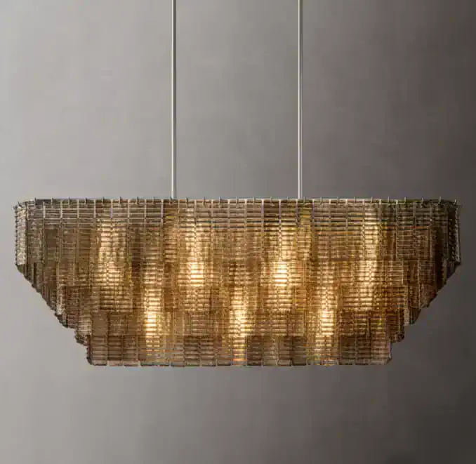 Elegant modern chandelier with warm lighting and metallic finish.