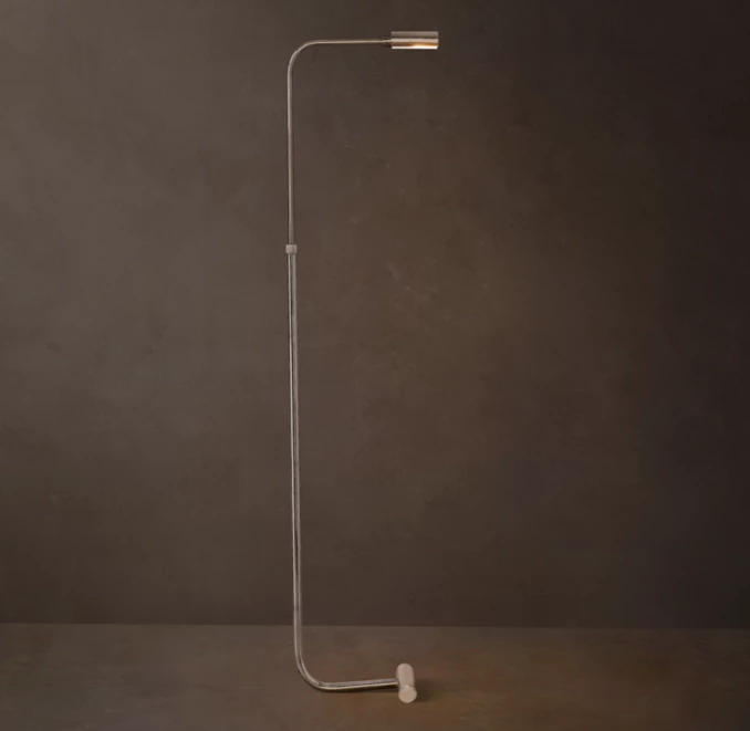 Sleek modern floor lamp with minimalist metal frame and adjustable LED light.