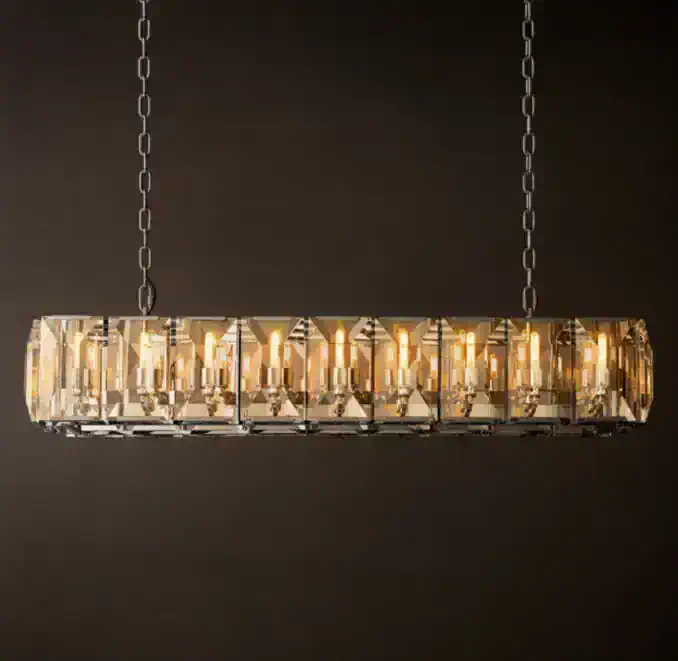 Elegant modern chandelier with crystal accents and warm lighting.
