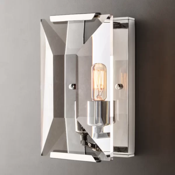 Contemporary wall sconce with sleek metallic finish and exposed filament bulb.