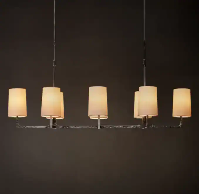 Elegant modern chandelier with six warm-toned lampshades.