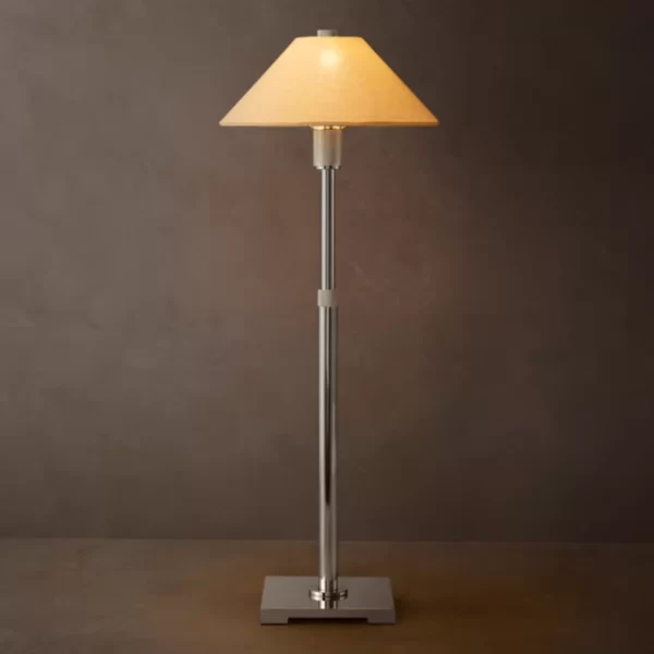 Elegant floor lamp with beige lampshade and chrome stand for modern decor.