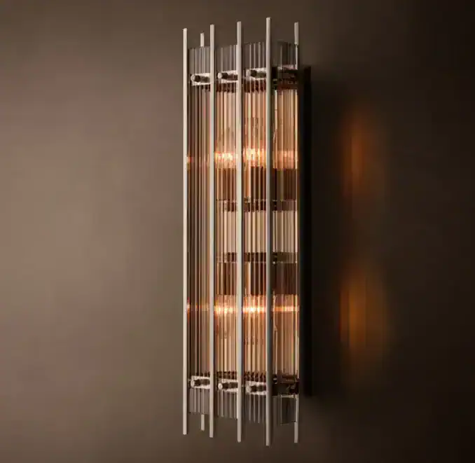 Contemporary wall-mounted lighting fixture with vertical metal rods and warm illumination.