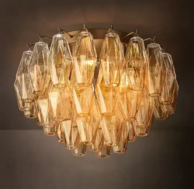 Elegant glass chandelier with warm lighting for luxurious interior decor.