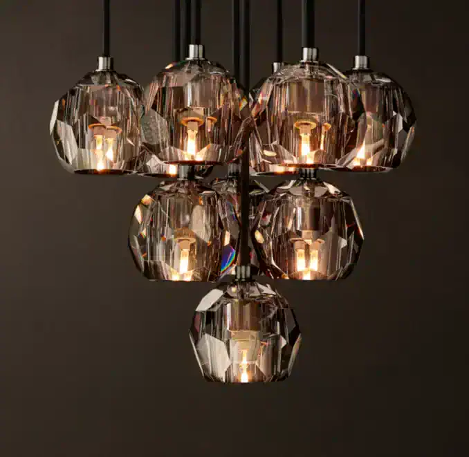 Elegant modern pendant lights with crystal-like glass shades for stylish interiors.
