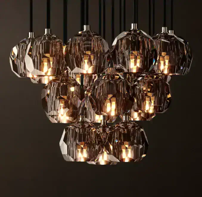 Elegant crystal chandelier with multiple faceted glass shades and warm lighting.