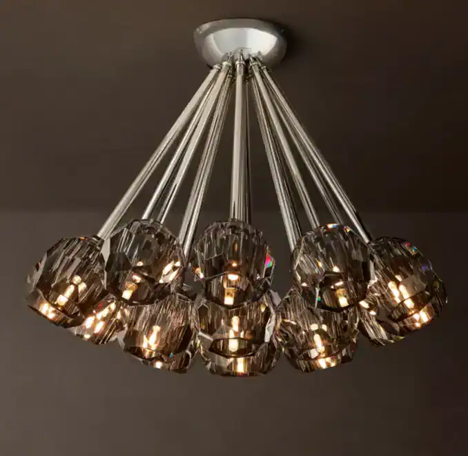Elegant modern crystal chandelier with multiple light bulbs and metallic finish.