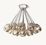 Elegant crystal chandelier with multiple glass shades and modern design.