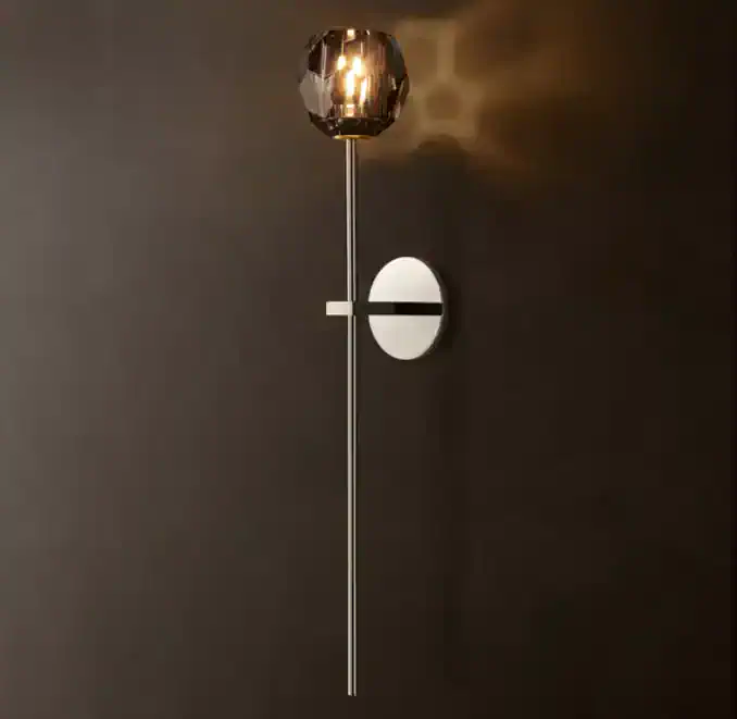 Elegant modern wall sconce with metallic finish and sleek design.