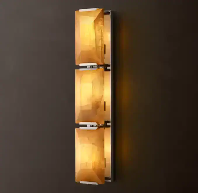 Modern wall light fixture with three illuminated wooden boxes.