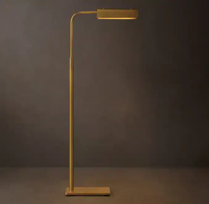 Elegant gold floor lamp with sleek design for modern interior lighting.