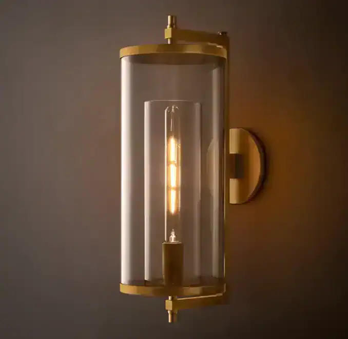 Elegant modern wall sconce with glass and gold accents for stylish lighting.