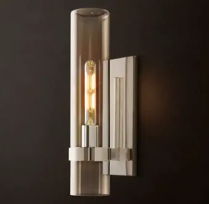 Contemporary wall-mounted light fixture with sleek design and warm illumination.