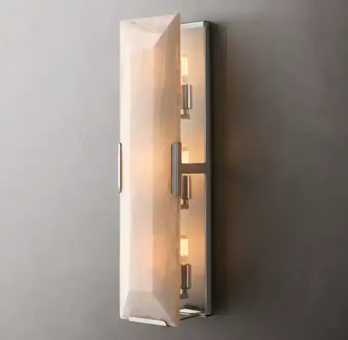 Modern wall sconce with warm LED lighting for home decor.