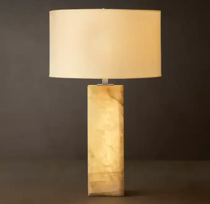 Modern calcite lamp with beige shade and rectangular base for elegant lighting.