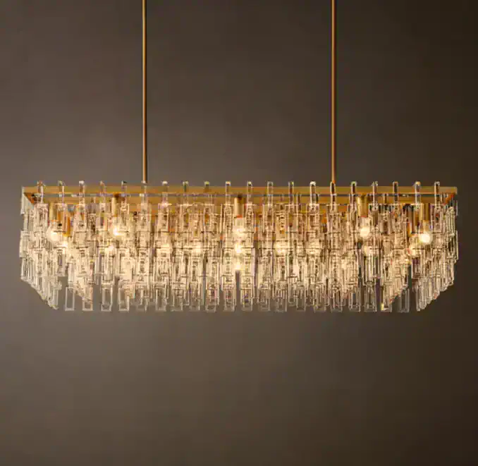 Elegant crystal chandelier by Gorvey Lighting with gold accents.
