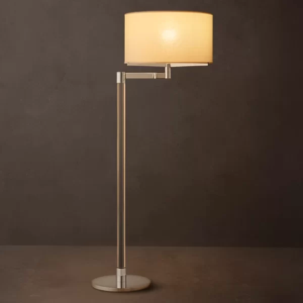 Elegant modern floor lamp with a beige lampshade and sleek metallic stand.