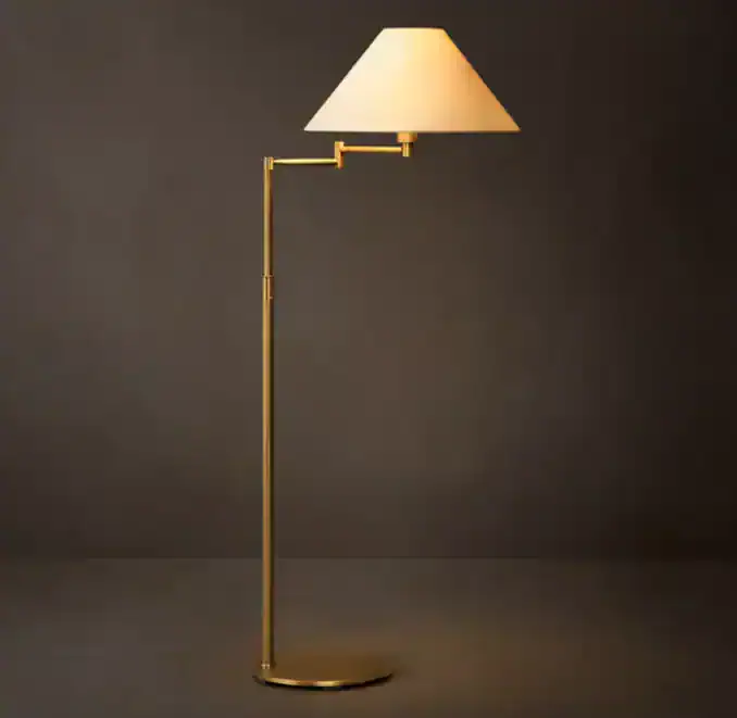 Elegant Gorvey lighting floor lamp with a white shade and gold stand.