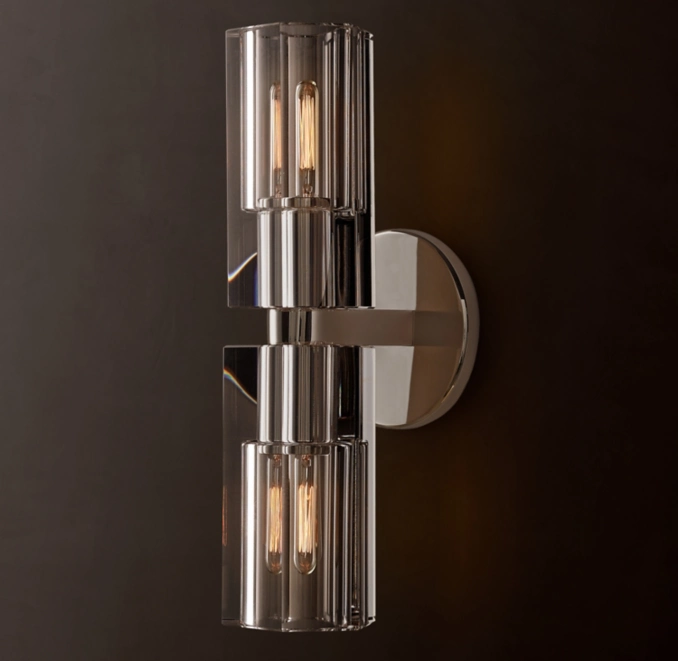 Modern wall sconce with glass and metal design by Gorvey Lighting.