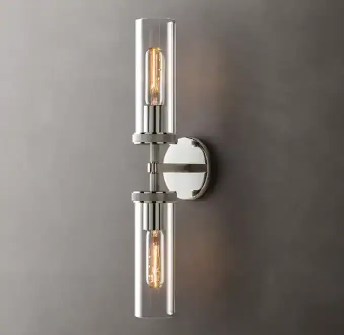 Contemporary wall sconce with glass tubes and Edison bulbs for stylish lighting.