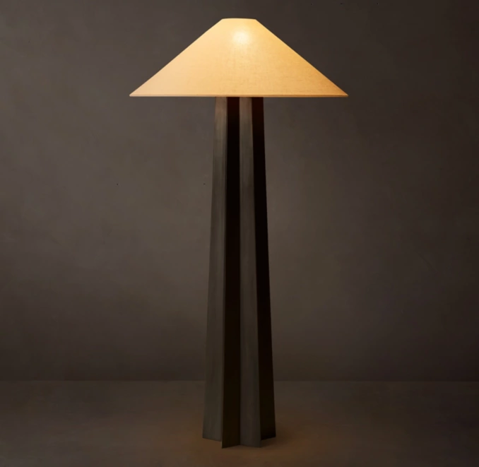 Modern floor lamp with a beige lampshade and black base for stylish lighting.