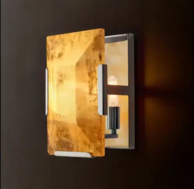 Modern wall sconce with a gold finish and sleek design for stylish lighting.