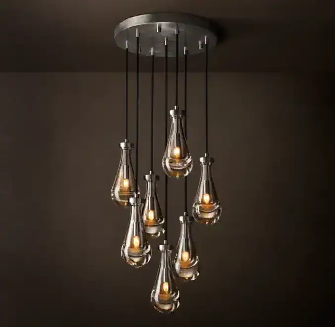 Elegant modern pendant chandelier with multiple glass bulbs and warm lighting.