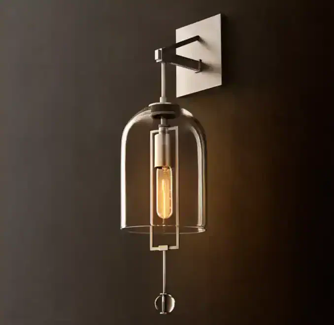 Modern wall lamp with glass shade and Edison bulb for stylish lighting.