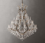 Luxury crystal chandelier with multiple candle-style lights and hanging crystals.