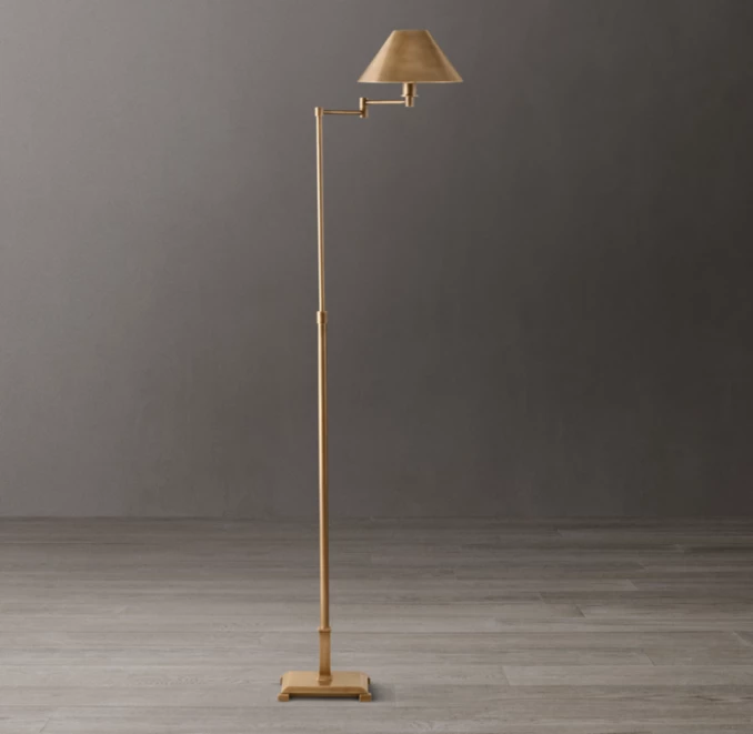 Elegant beige floor lamp with adjustable arm and shade for modern interiors.