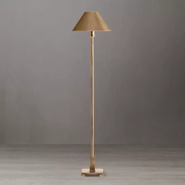 Elegant gold floor lamp with beige shade for home decor.