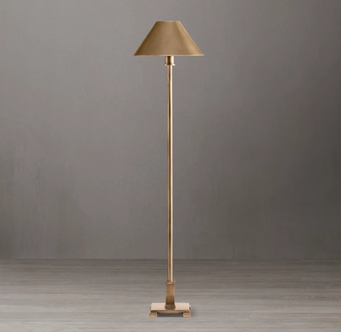 Elegant gold floor lamp with beige shade for home decor.