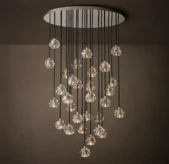 Elegant modern crystal chandelier with multiple hanging glass globes.