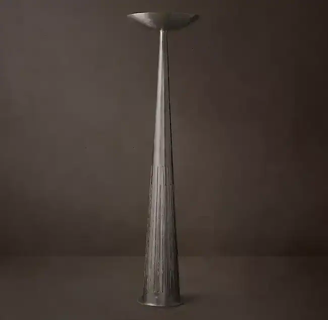 Elegant brass torchiere floor lamp with a sleek design and upward lighting.