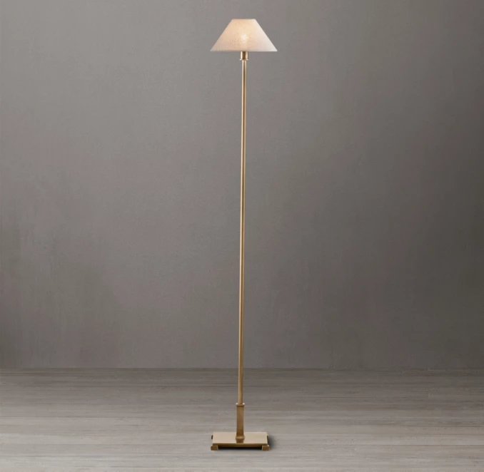 Elegant steel floor lamp with petite linen shade for modern interiors.
