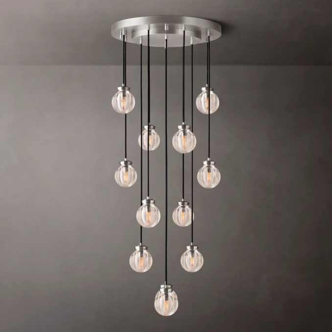 Elegant modern pendant chandelier with multiple glass globes and black cords.