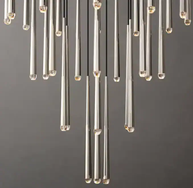 Elegant brass chandelier with glass tips from Gorvey Lighting.
