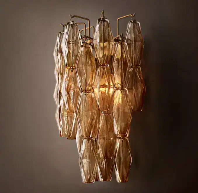 Elegant glass and brass wall light fixture by Gorvey Lighting.