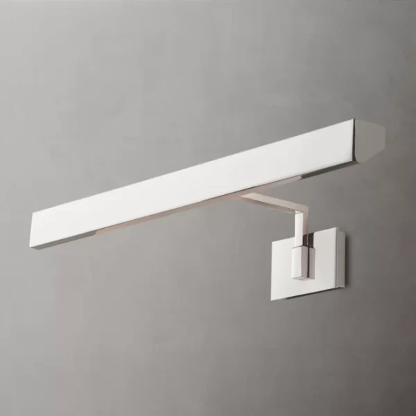 Modern brass picture light for wall decor and art illumination.