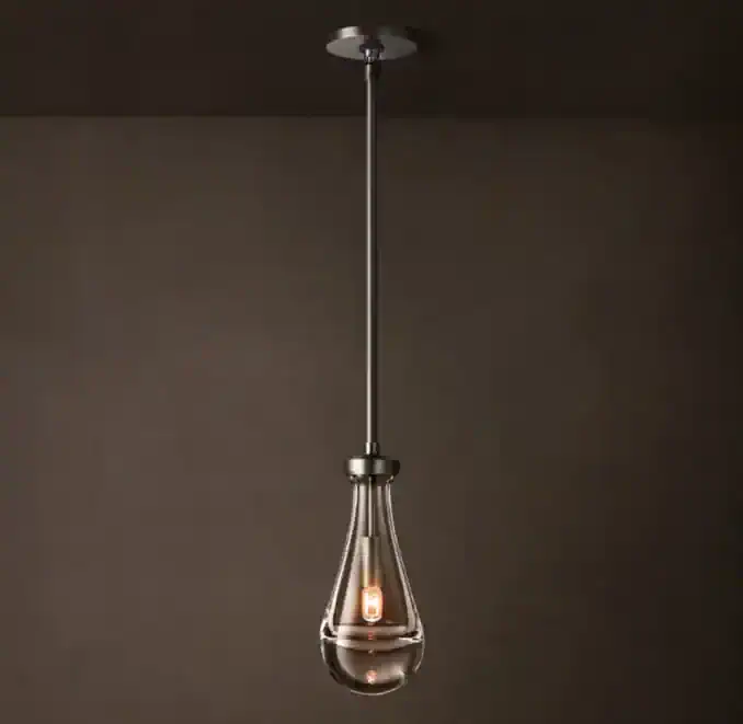 Modern brass and glass pendant light for contemporary interior decor.