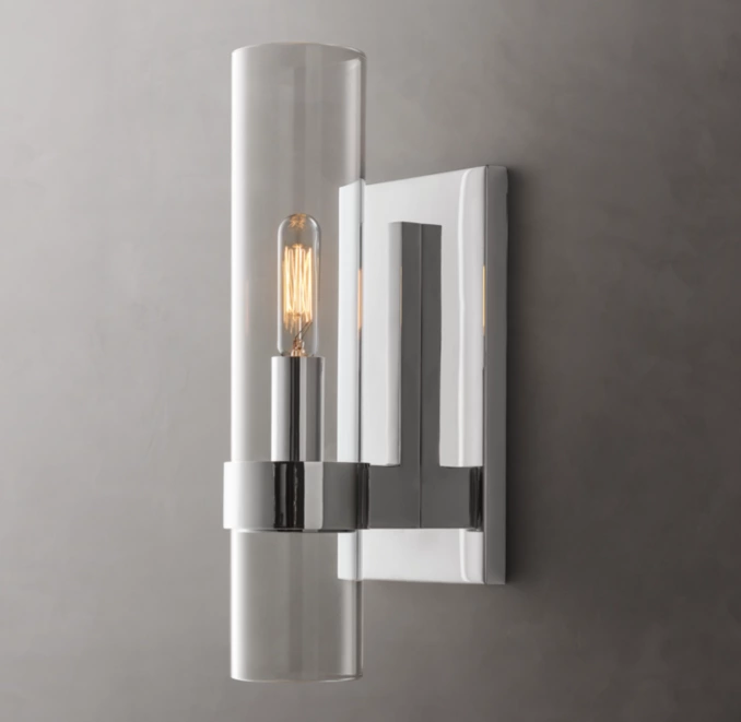 Modern outdoor wall light with glass and metal design for exterior decor.