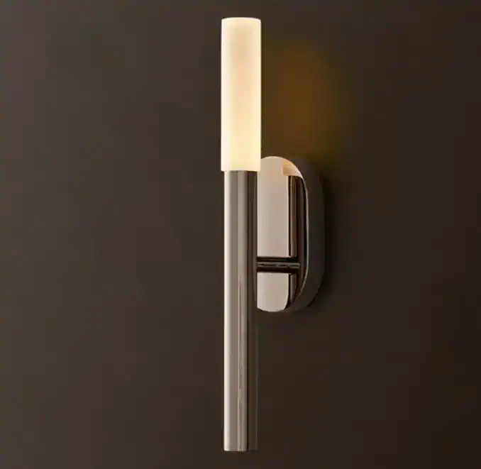 Modern wall sconce with LED light and etched glass shade for stylish lighting.