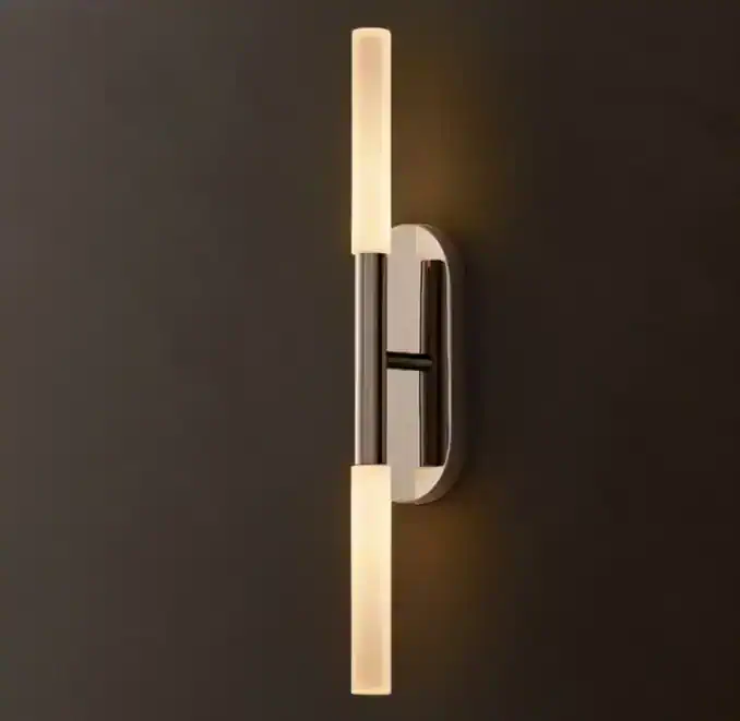 Modern brass glass sconce with linear LED light for wall decor.